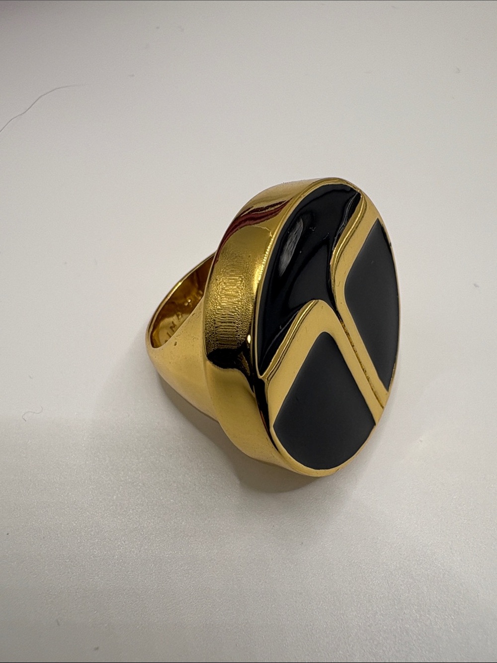 Trina Turk Gold Tone Ring with Black Enamel Initials Inlay